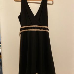 Black dress with a tan stripe